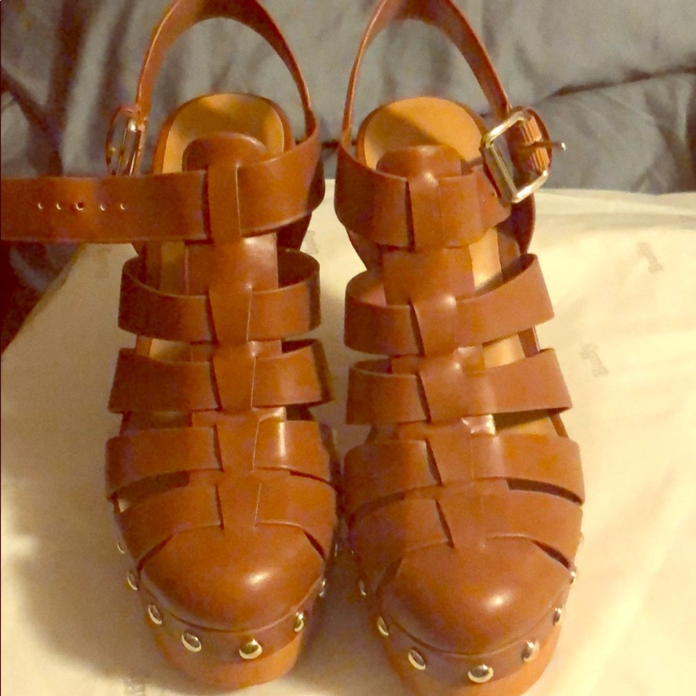 Nine West, close toe, wooden heel strappy shoe.